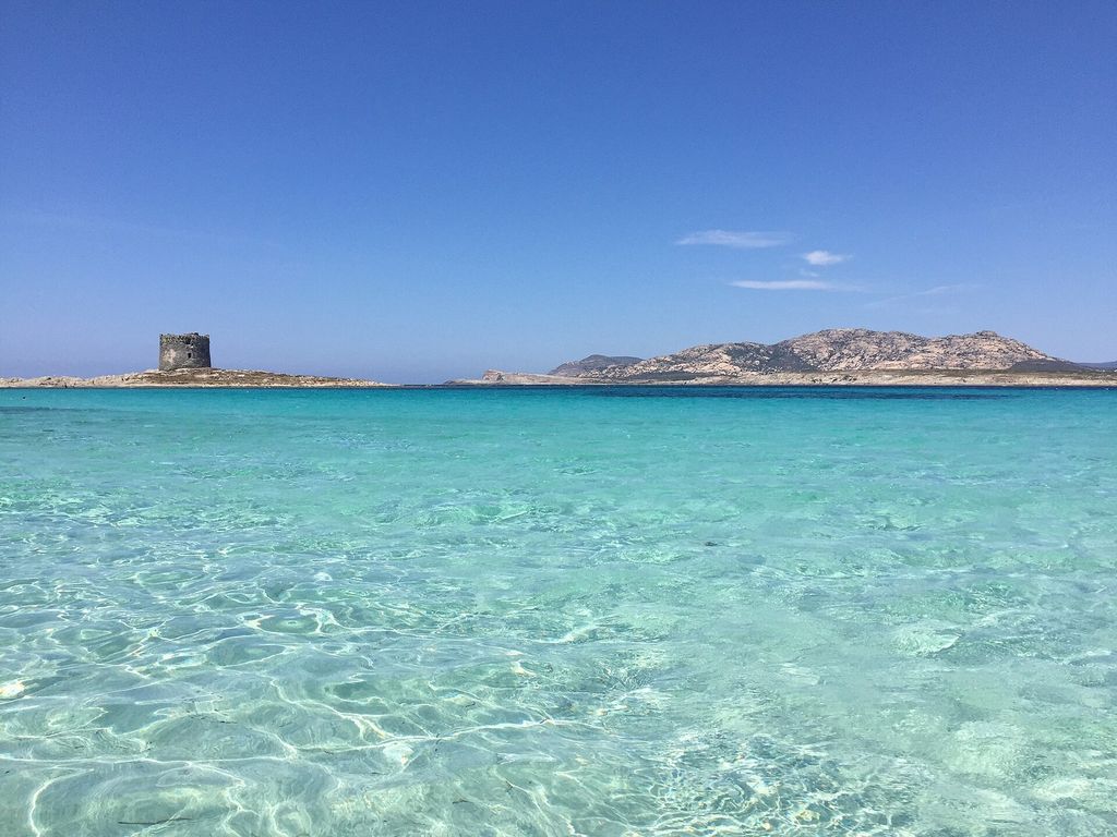 Torre della Pelosa and the clear water of La Pelosa beach